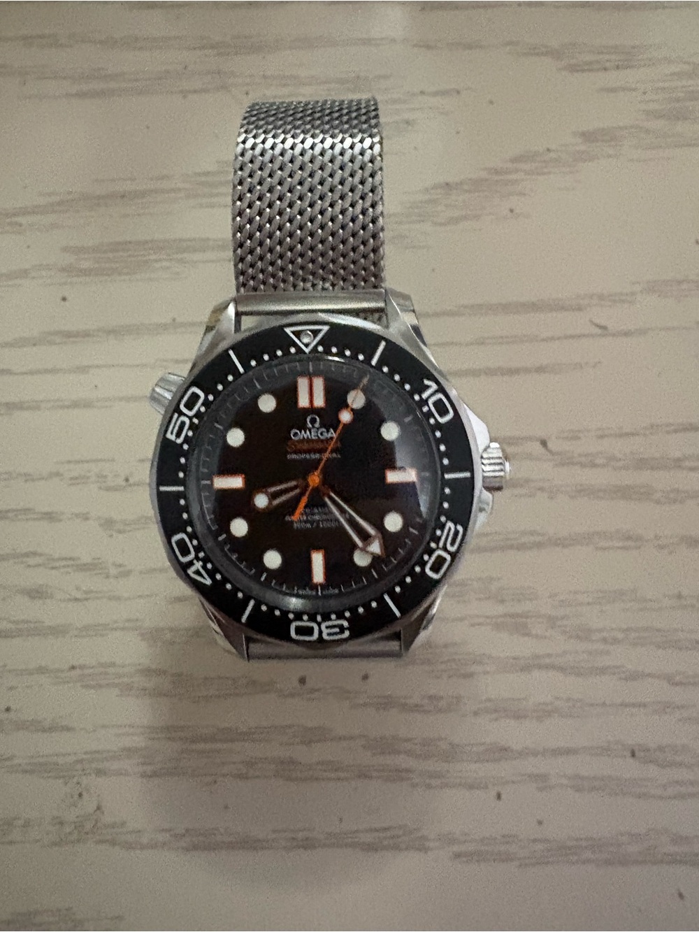 Omega Black Dial Diver Watch with Orange Accents and Mesh Bracelet